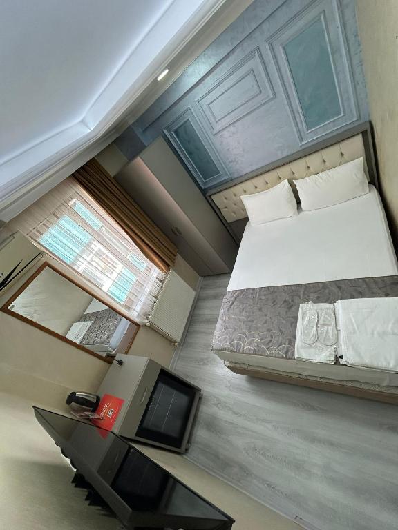 Giường trong phòng chung tại Grand Kybele Hotel