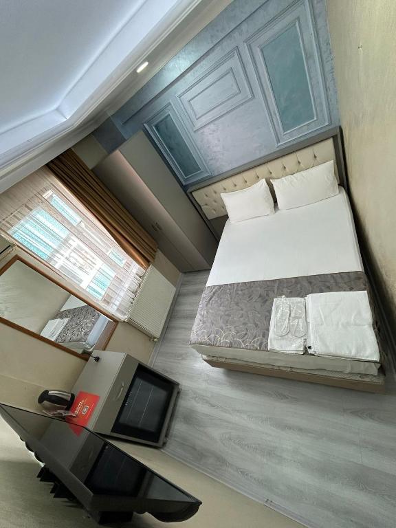 Giường trong phòng chung tại Grand Kybele Hotel