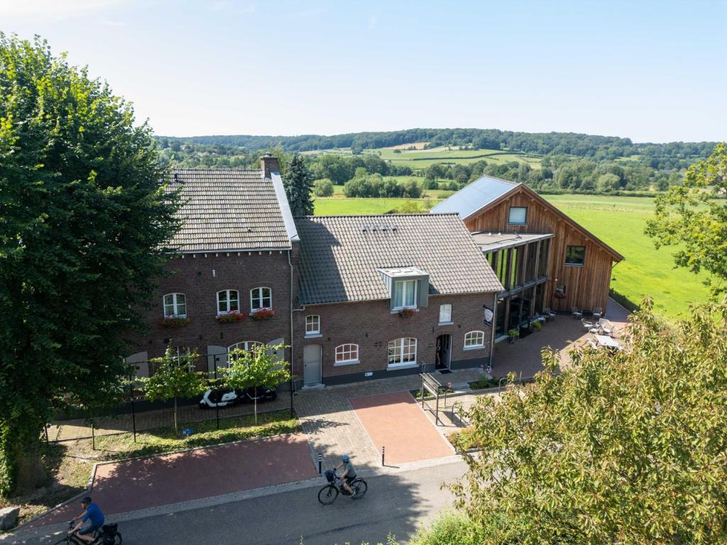 an aerial view of a house with trees at Hof van Kleeberg in Mechelen