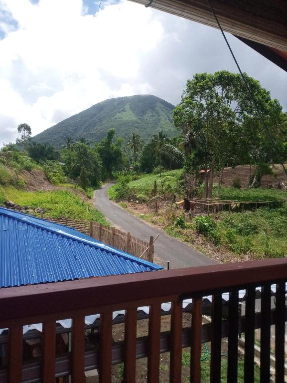 a view of a mountain from a balcony at Homestay Alina in Tomohon