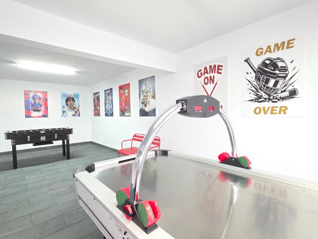 a room with a ping pong table and a sink at RODRIGUES ViLLA in Funchal