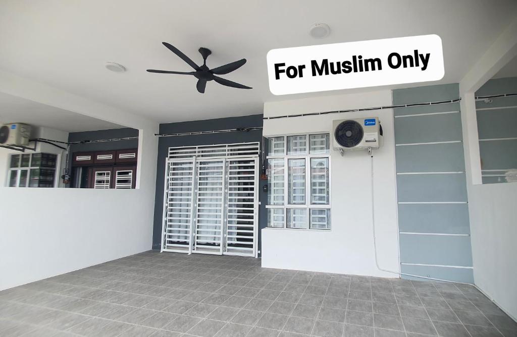 a room with a door and a sign that reads for muslin only at Aristar D'Sejahtera Homestay 4 mu5lim in Bandar  Pusat Jengka