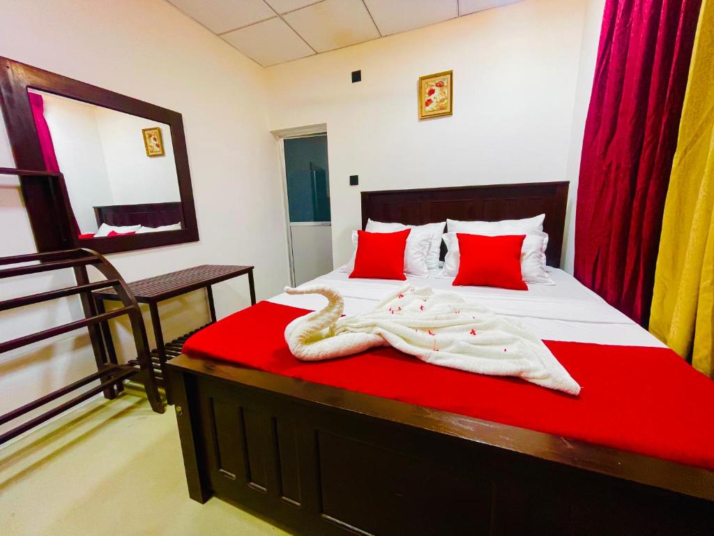 Ένα ή περισσότερα κρεβάτια σε δωμάτιο στο The Lavish Polonnaruwa