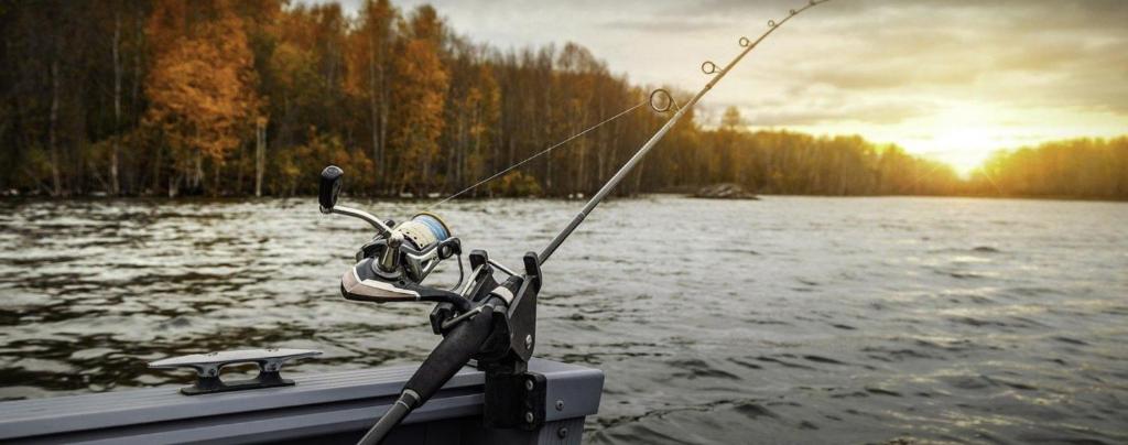 a man sitting on a boat holding a fishing rod at Recreatie Chalet in Dordrecht