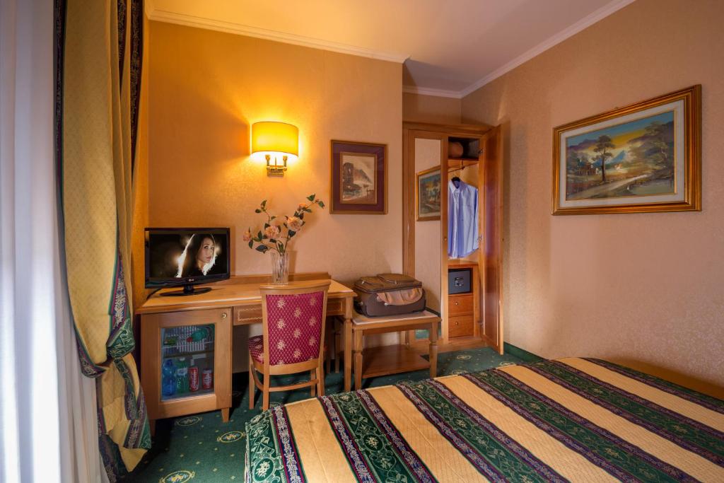 Postel nebo postele na pokoji v ubytování Colonna Hotel