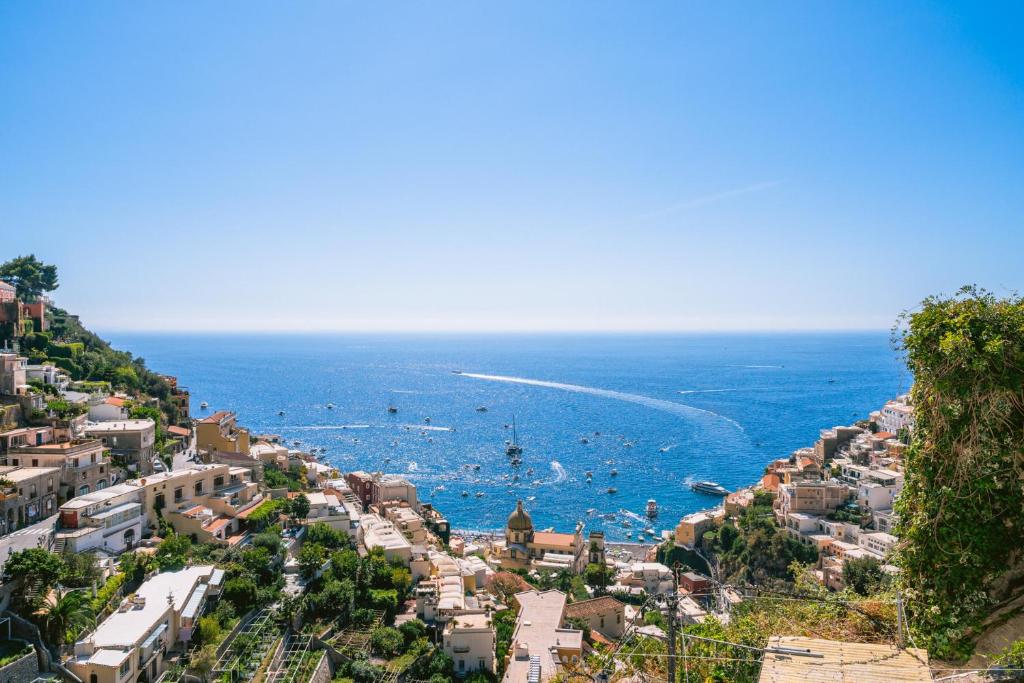a view of a city with boats in the water at Villa Mary Suites in Positano