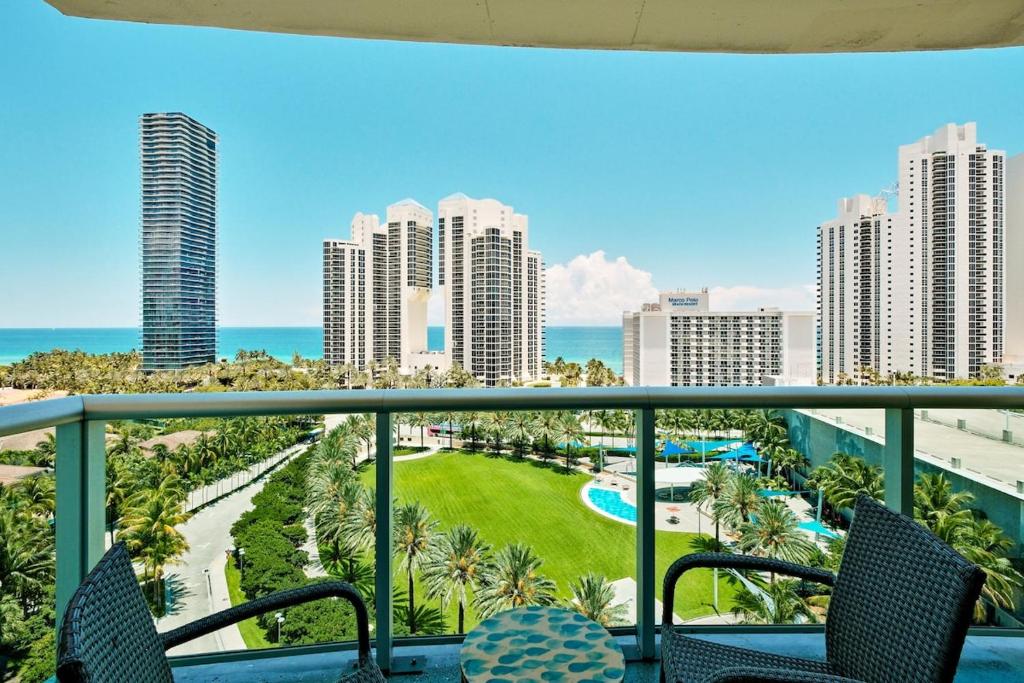 a balcony with a view of the ocean and buildings at Miami Beach Paradise-Ocean View Apartments -Free Parking in Sunny Isles Beach