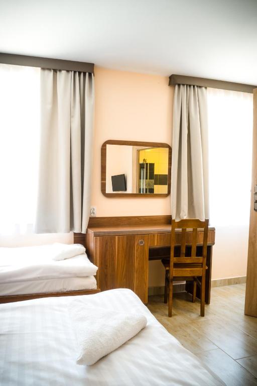 Posteľ alebo postele v izbe v ubytovaní ZGODA Kompleks Hotelarski
