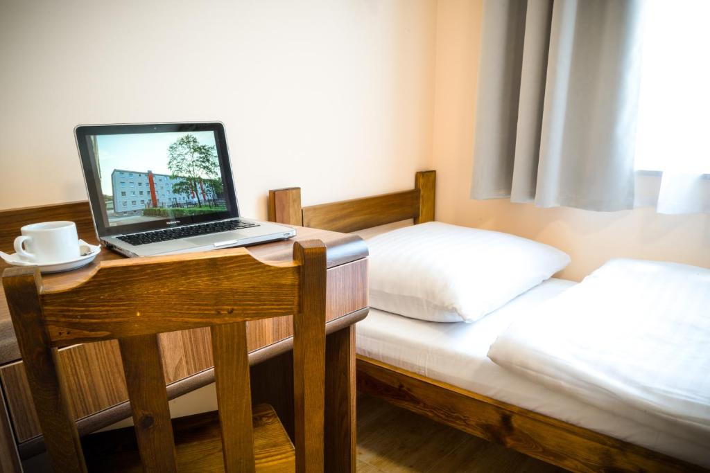 Posteľ alebo postele v izbe v ubytovaní ZGODA Kompleks Hotelarski