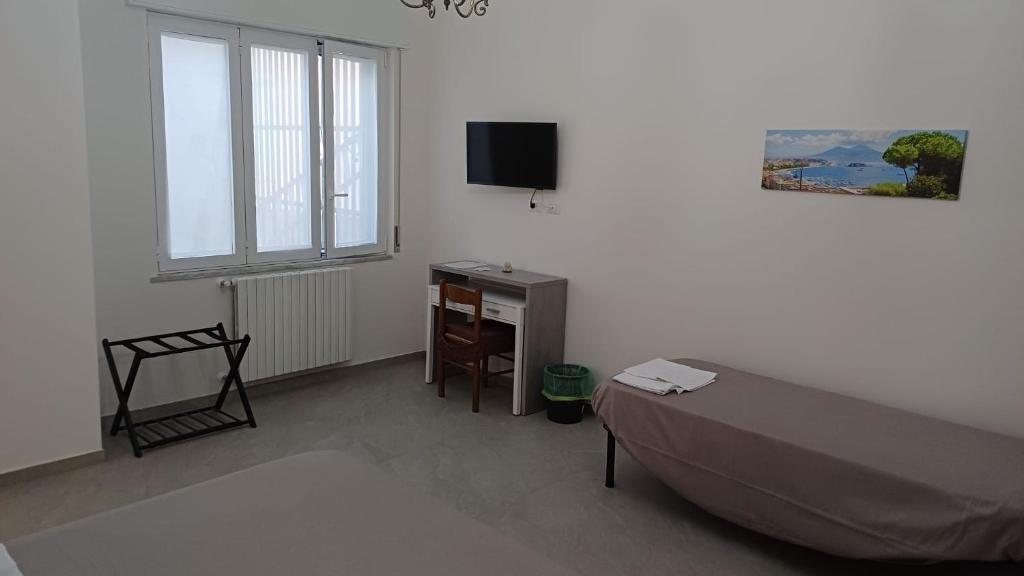 TV a/nebo společenská místnost v ubytování Casa Vacanza Elena