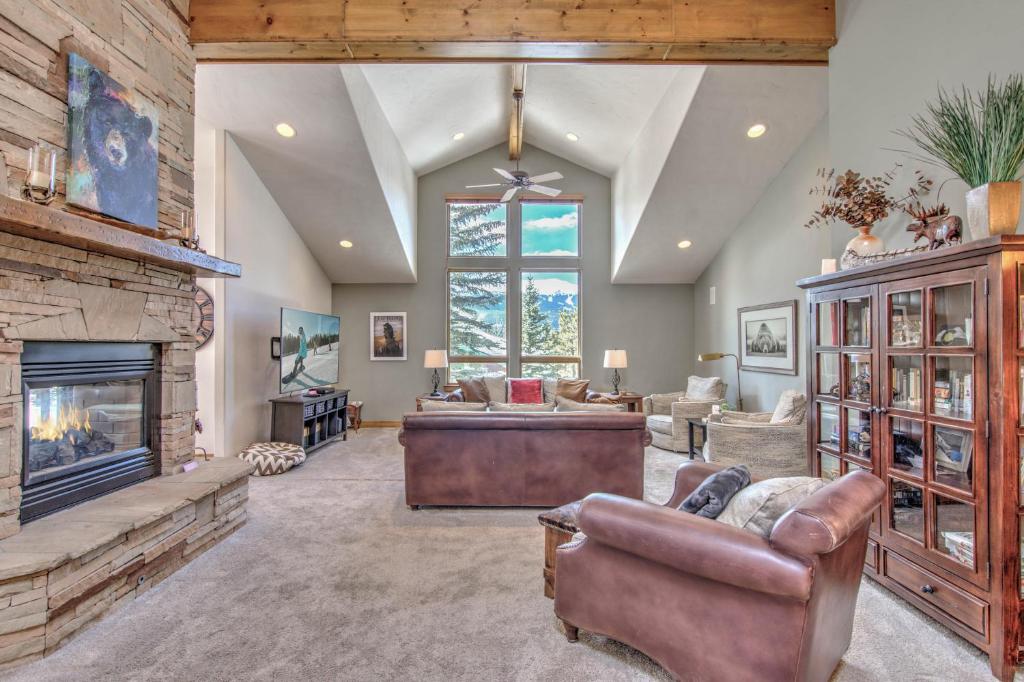 a living room with a couch and a fireplace at Lazy Bear in Breckenridge