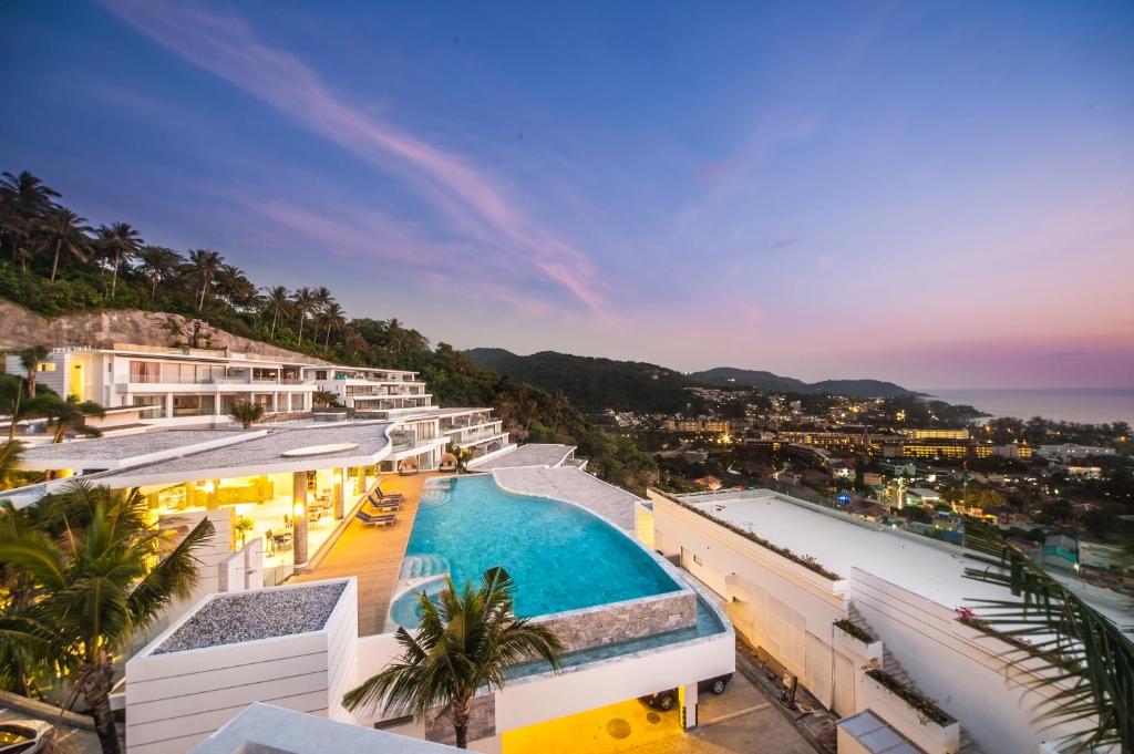 a view of a resort with a swimming pool at The View Phuket By RESAVA in Kata Beach