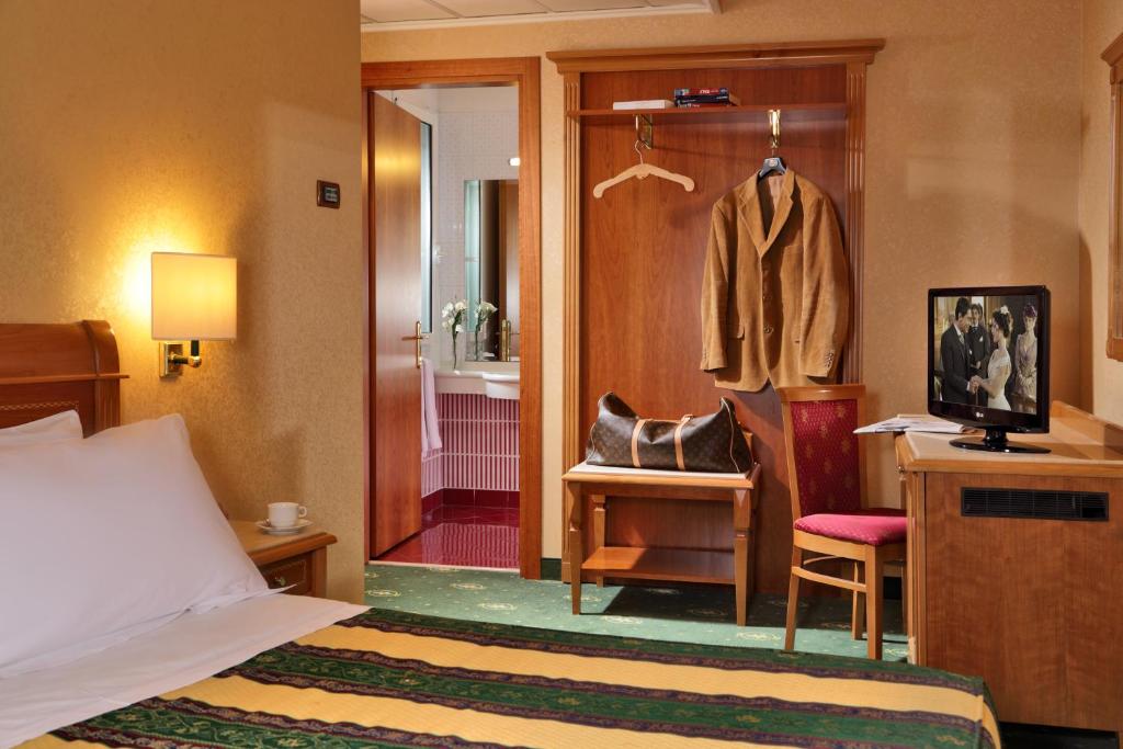 Postel nebo postele na pokoji v ubytování Colonna Hotel