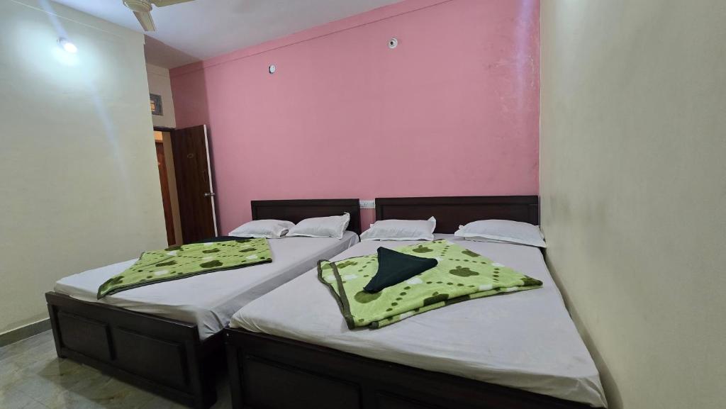 Ένα ή περισσότερα κρεβάτια σε δωμάτιο στο Hk Guest house