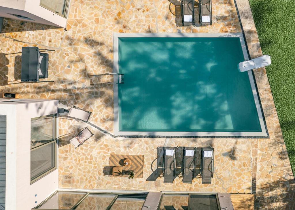 an overhead view of a swimming pool in a house at NOPI HOLIDAYS Zante Exclusive Villa in Zakynthos Town