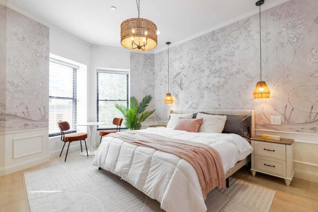 a bedroom with a large bed and a desk at Brooklyn Brownstone in Brooklyn