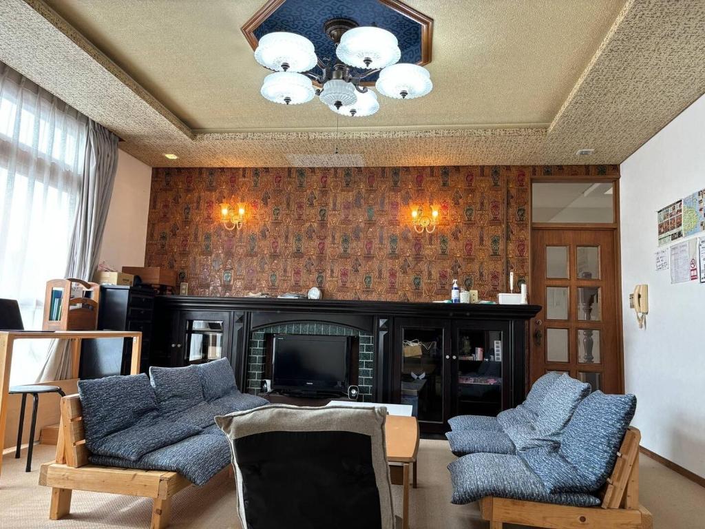 a living room with two couches and a fireplace at Kushiro - House - Vacation STAY 20411 in Irifunechō