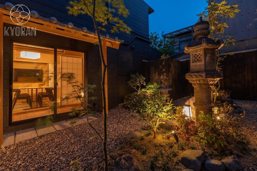 a garden in front of a house at night at Jinglan Nanshan - Vacation STAY 65363v in Kyōto