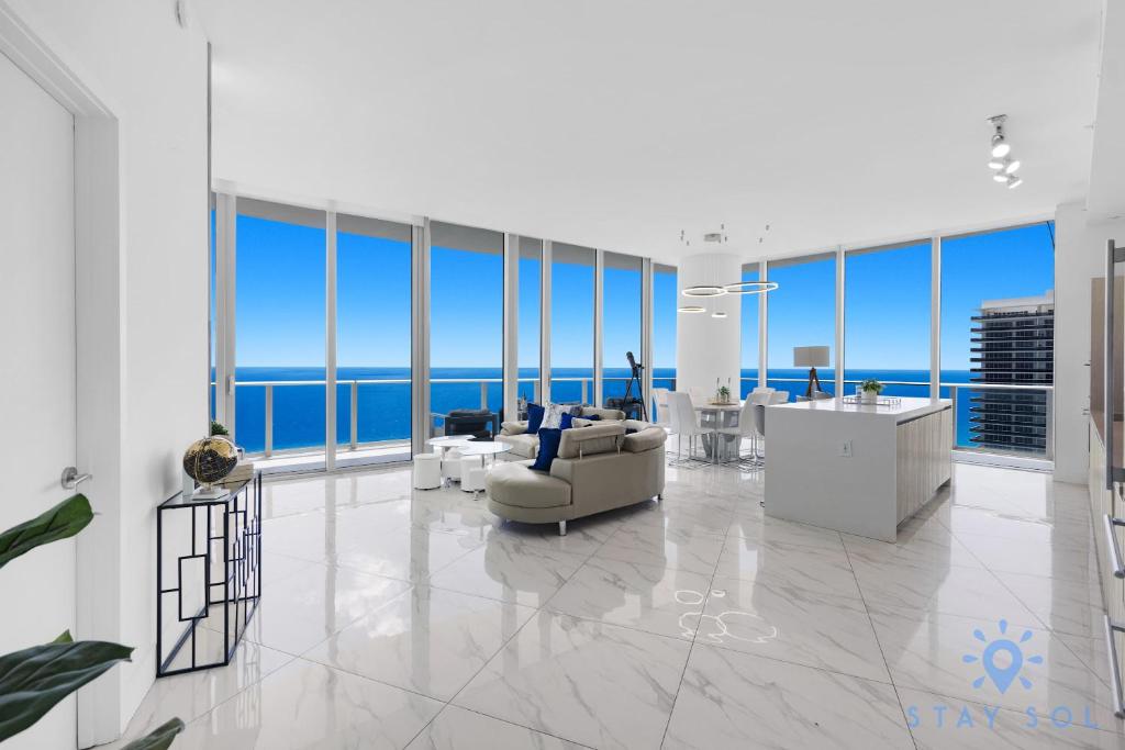 a living room with a view of the ocean at Oceanfront Penthouse -3BR + Pool + Beach access in Hollywood Beach