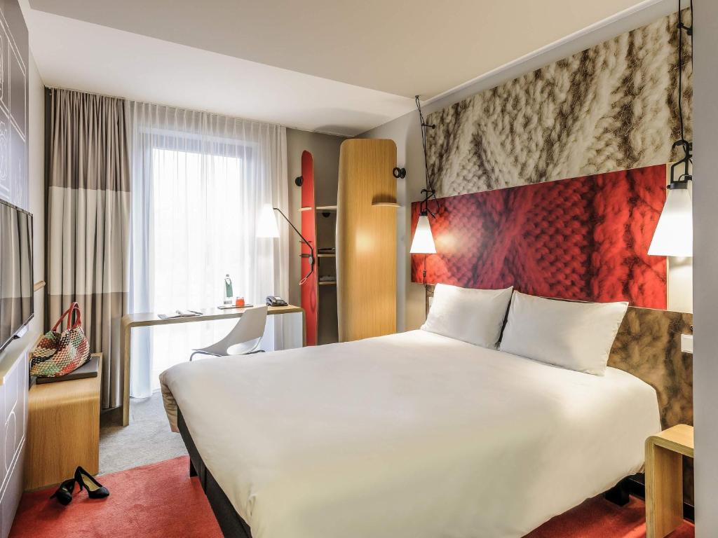Кровать или кровати в номере Ibis Berlin Hauptbahnhof