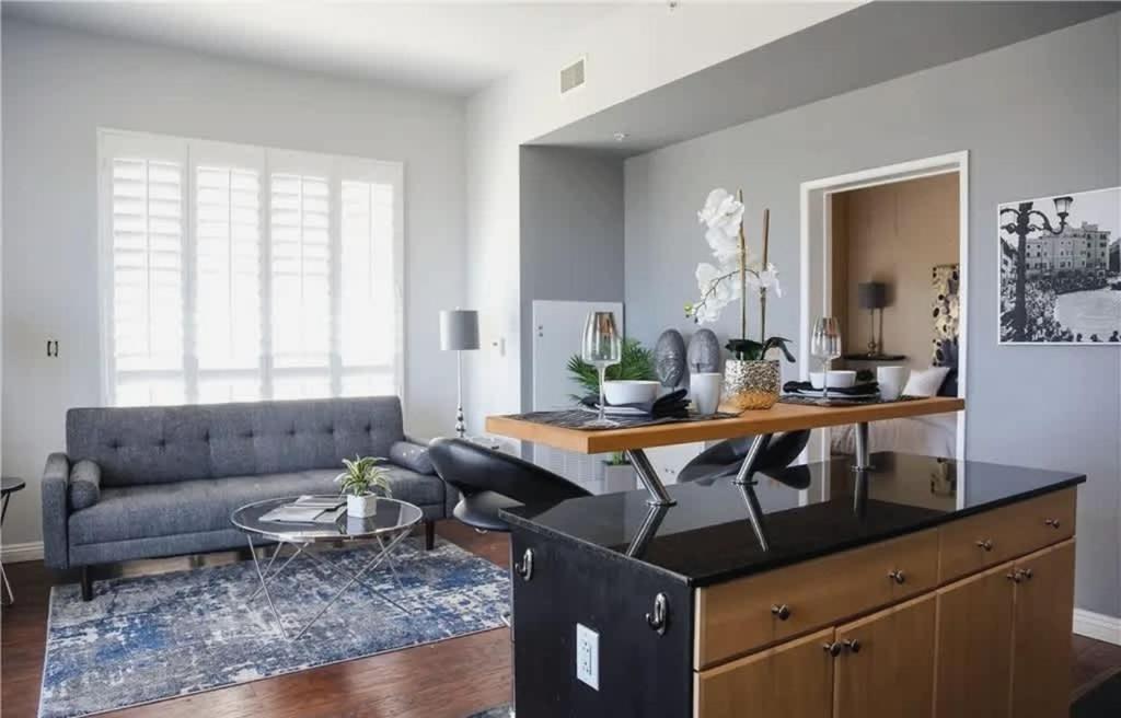 a living room with a couch and a table at One Bedroom Condo with Ocean and Marina Views in Long Beach