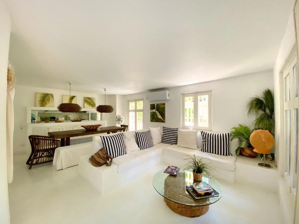 a living room with a white couch and a table at Apartment in the Historical Center of Cartagena in Cartagena de Indias