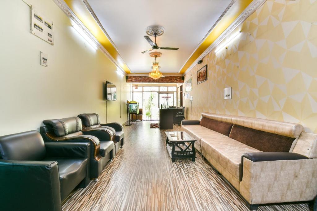 a large living room with couches and a couch at Hotel O Awirank in Patna