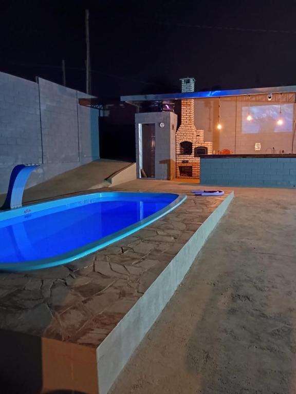 Bazén v ubytování Espaço de lazer Poço Valioso nebo v jeho okolí