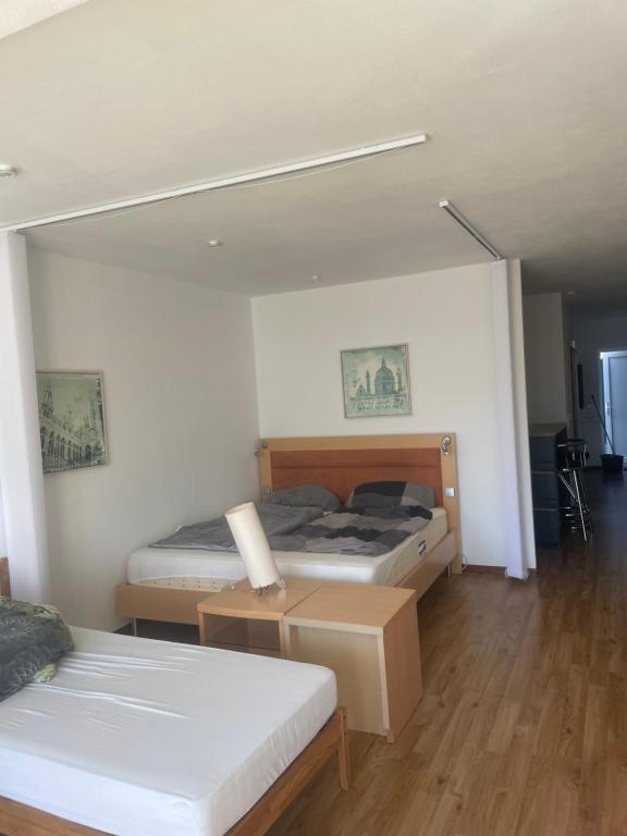 a bedroom with two beds and a large mirror at Schwavillage in Schwadorf