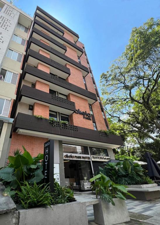 a tall building with plants in front of it at Akela Park Hotel in Medellín