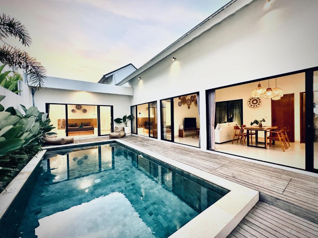 a swimming pool in the backyard of a house at Villas Topazio and Opalo -- Gateway to Uluwatu beaches in Uluwatu