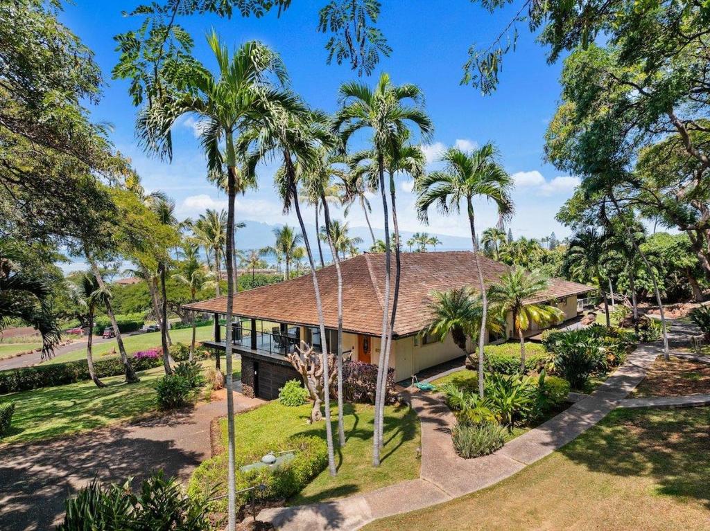 an aerial view of a house with palm trees at Hale Kalapu · Large Home 180° Ocean Views Walk2Beach Hale Kalapu in Kaanapali