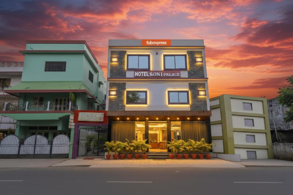 a building with a sunset in the background at FabExpress Soni Palace in Ujjain