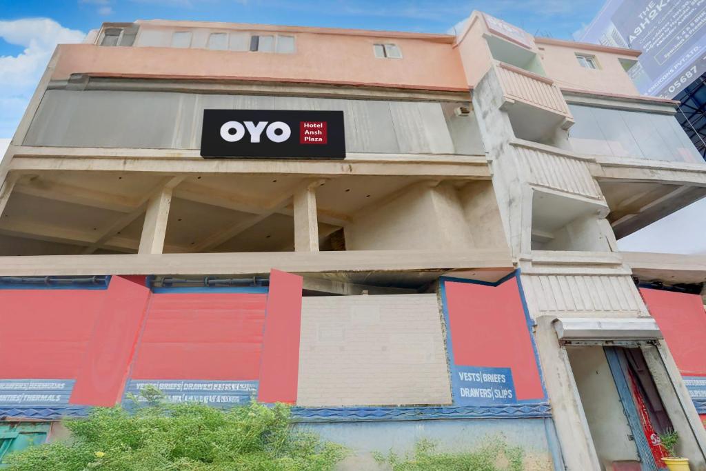 a building with an ovo sign on it at Hotel O Ansh Raj Hotel in Patna City