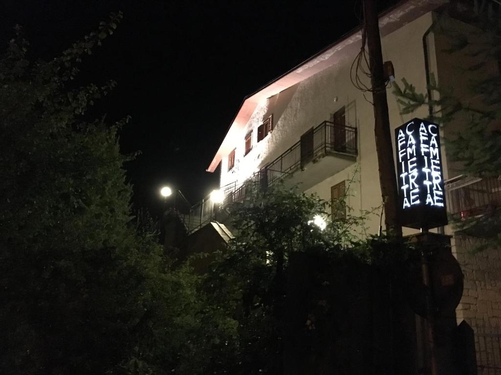 a sign on the side of a building at night at Il Bucaneve in Barrea