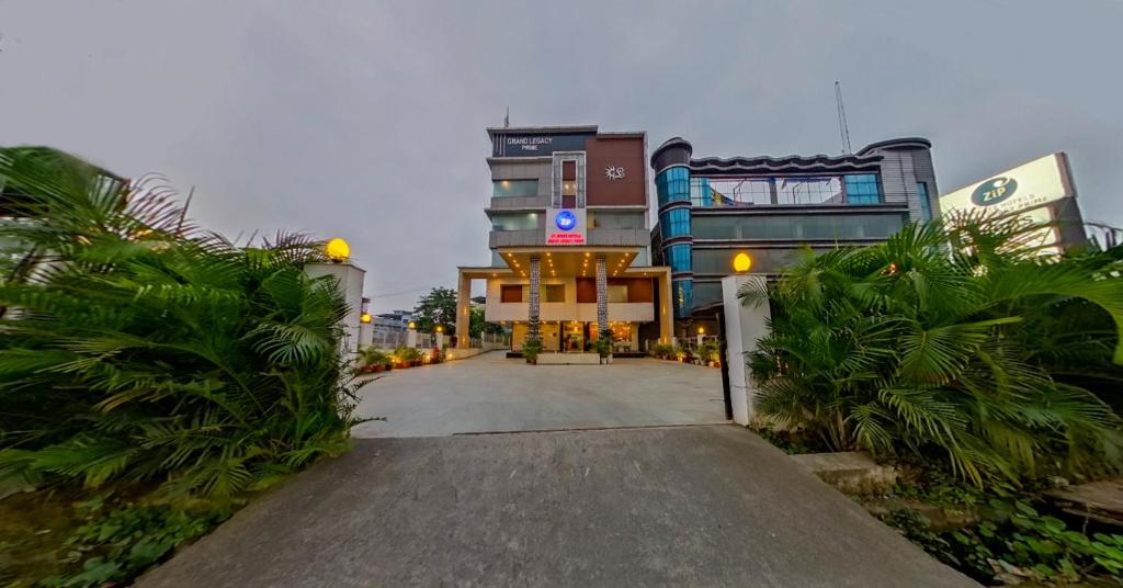a building with a walkway in front of it at Zip By Spree Hotels Grand Legacy Prime in Dehradun