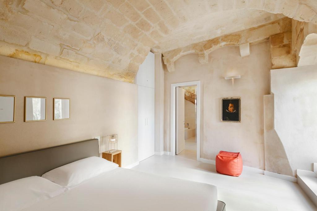 Posteľ alebo postele v izbe v ubytovaní I Tre Portali Luxury Suites