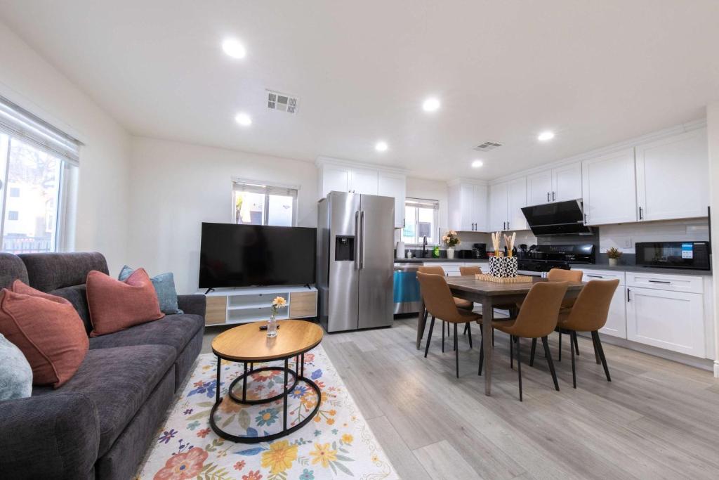 a living room with a couch and a table at Modern Luxe Ensuite by USC Shared Living in Los Angeles