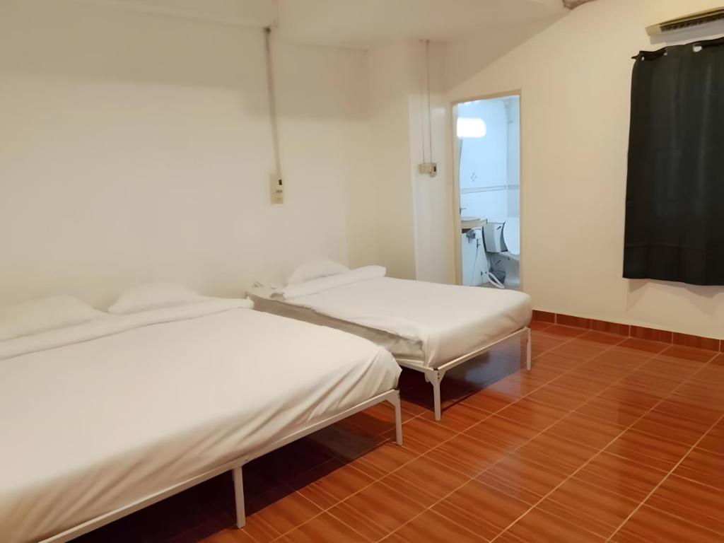 Ένα ή περισσότερα κρεβάτια σε δωμάτιο στο GO INN Patong Beach Phuket - โก อินน์ หาดป่าตอง ภูเก็ต