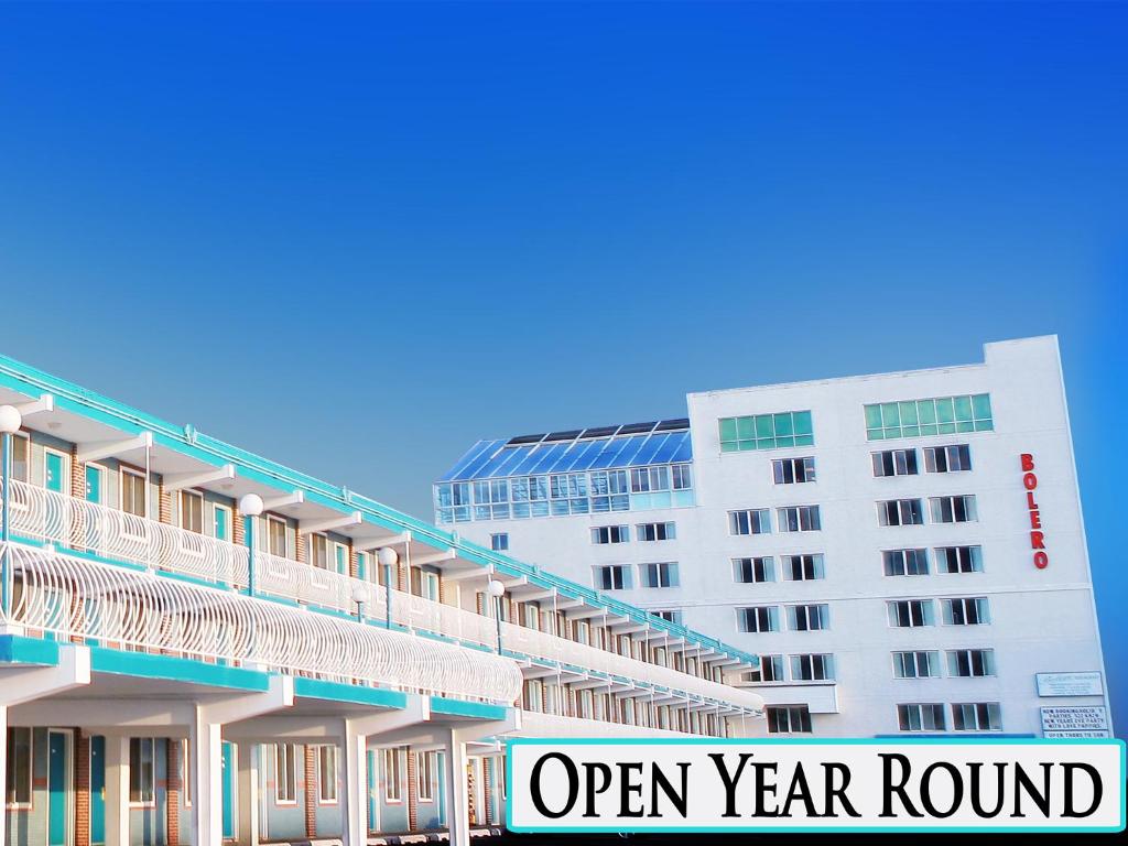 a large white building with an open year round sign at Bolero Resort in Wildwood