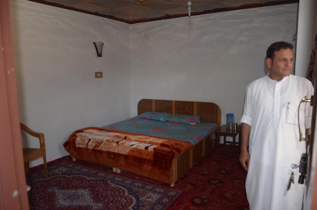 Postel nebo postele na pokoji v ubytování Howrah Guest House