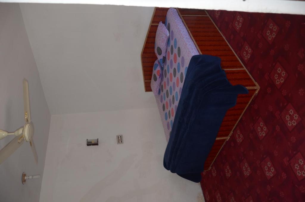 Postel nebo postele na pokoji v ubytování Howrah Guest House