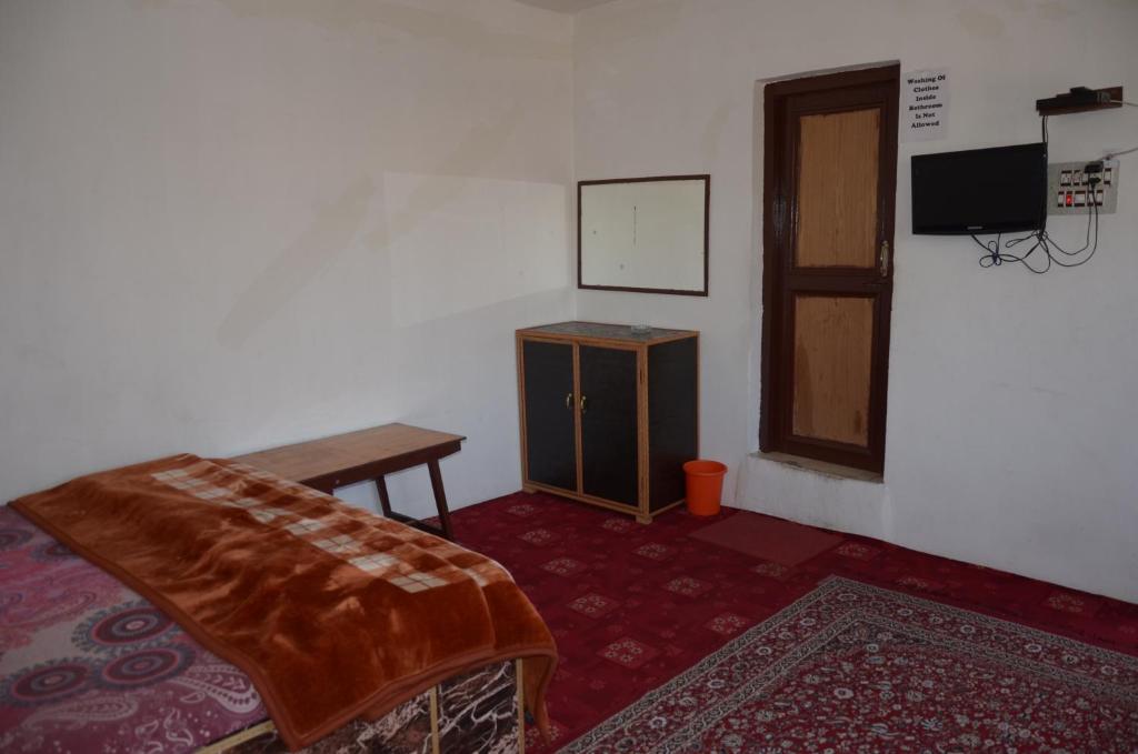 Postel nebo postele na pokoji v ubytování Howrah Guest House