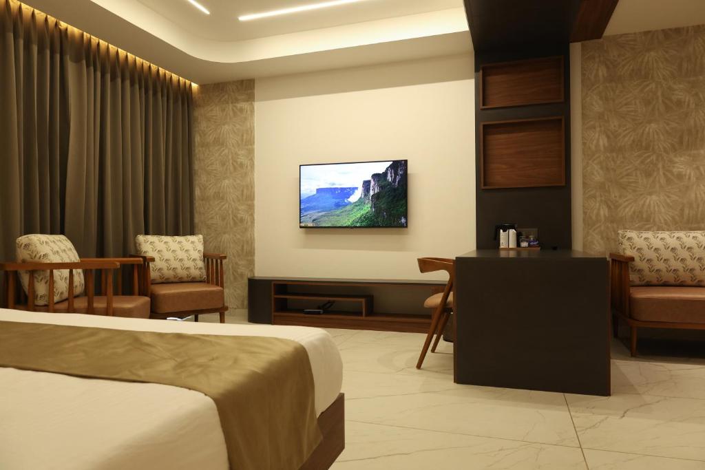 TV a/nebo společenská místnost v ubytování CASTELO Inn