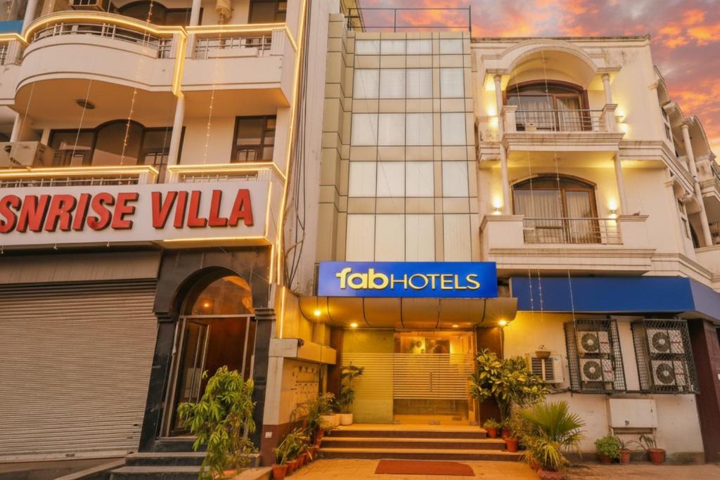 a hotel with a sign in front of a building at Via Le Grand in New Delhi