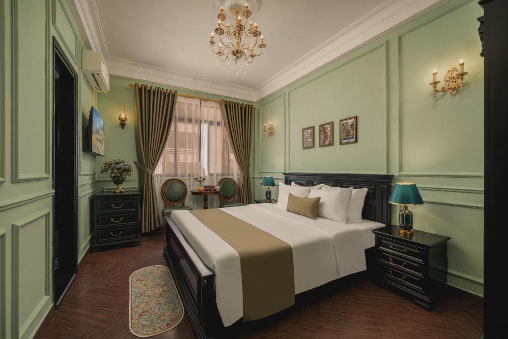 Postel nebo postele na pokoji v ubytování Vina Vintage Hotel