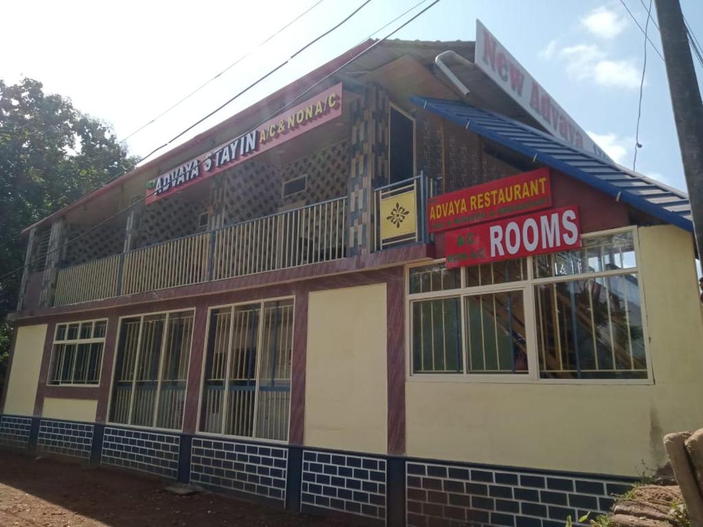 a building with signs on the side of it at Nature Stay in Gokarna