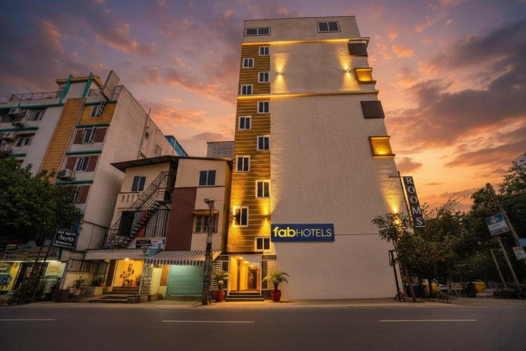 a tall building with a sign on the side of it at FabHotel HSR Gateway in Bengaluru