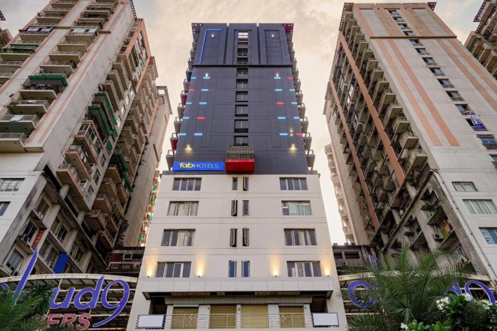 a tall building in the middle of two tall buildings at Via Cloud 9 in Ghaziabad