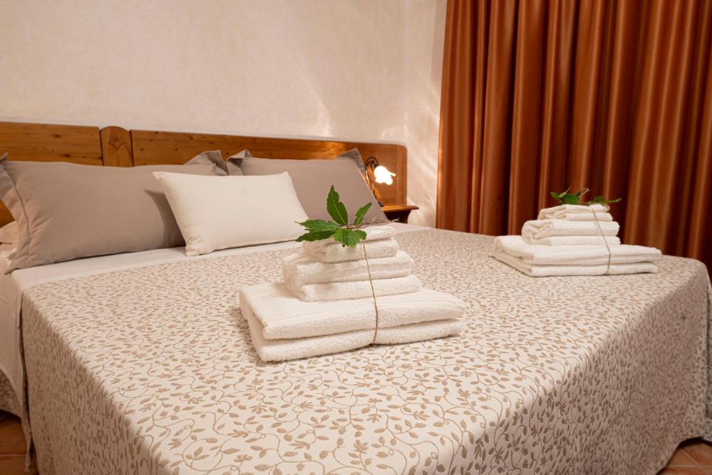 Postel nebo postele na pokoji v ubytování B&B Sentiero del Ciolo